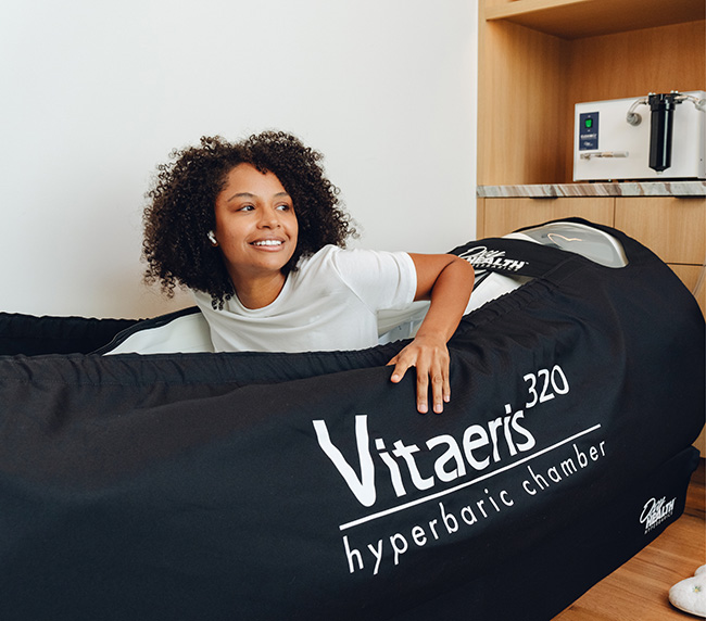 Guest relaxing inside the Vitaeris 320 hyperbaric chamber at iCRYO Port St. Lucie
