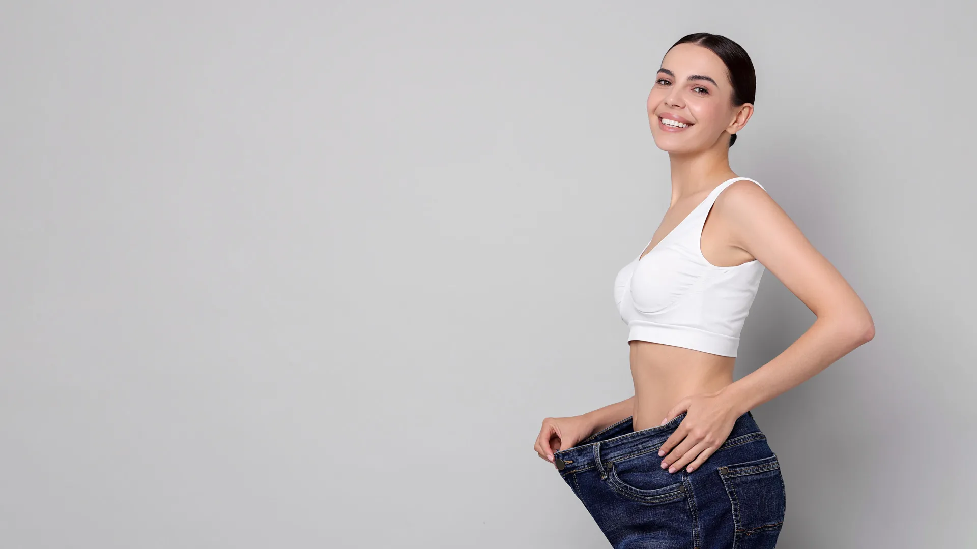Woman celebrating weight loss results at iCRYO Port St. Lucie Medical Weight Loss program